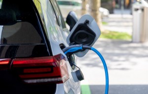 an electric car is plugged into a charging station