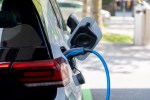 an electric car is plugged into a charging station