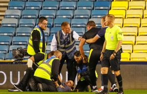 Carabao Cup clash suspended as pitch invader restrained by goalkeeping coach